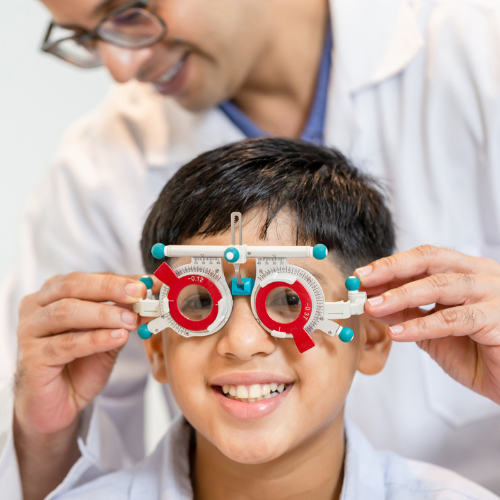 Child having an age-appropriate vision assessment with an ophthalmologist